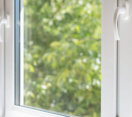 Modern residential glass window installation with white frames in Perth WA home
